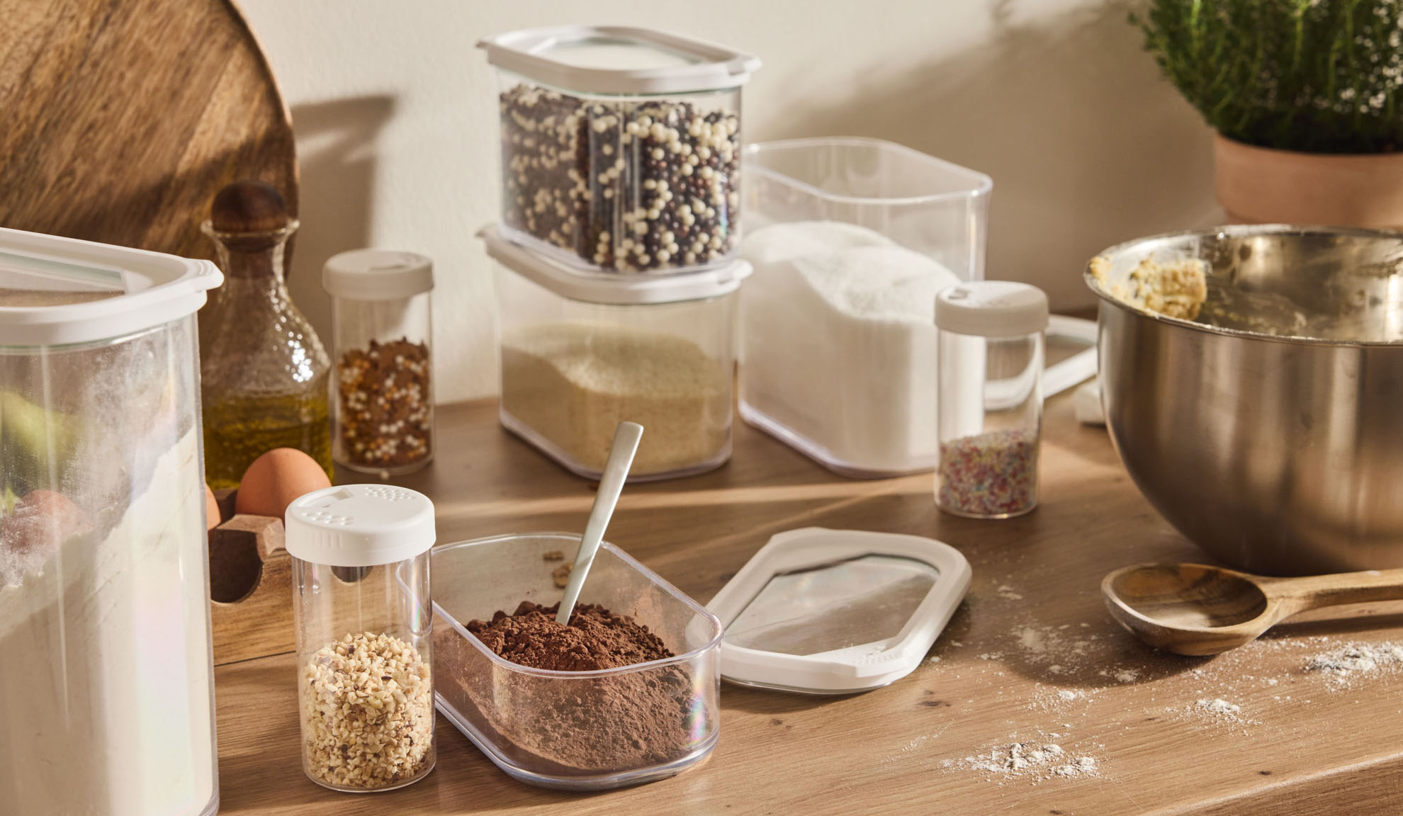 Kitchen countertop with baking ingredients and clear containers