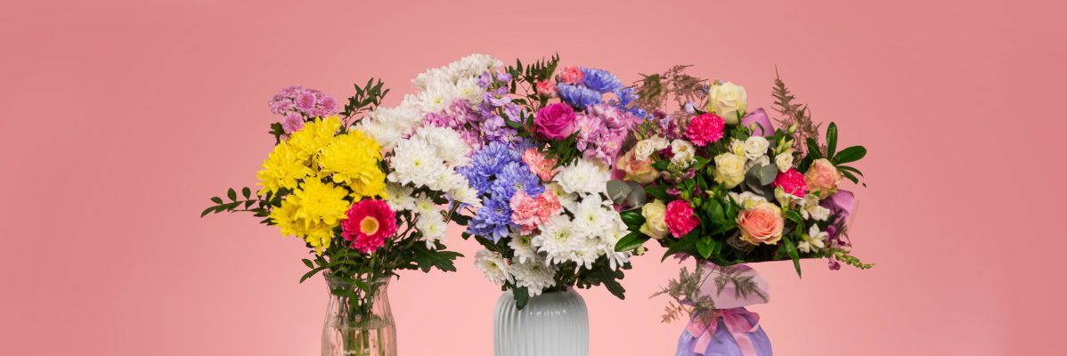 Three vibrant bouquets of mixed flowers, including chrysanthemums, roses, and carnations.