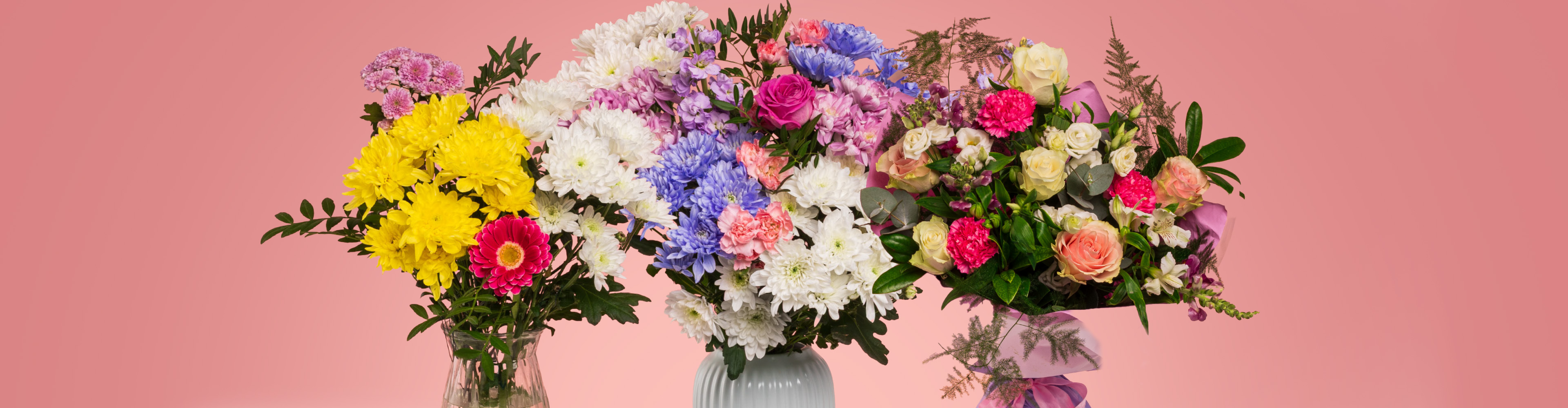 Three vibrant bouquets of mixed flowers, including chrysanthemums, roses, and carnations.