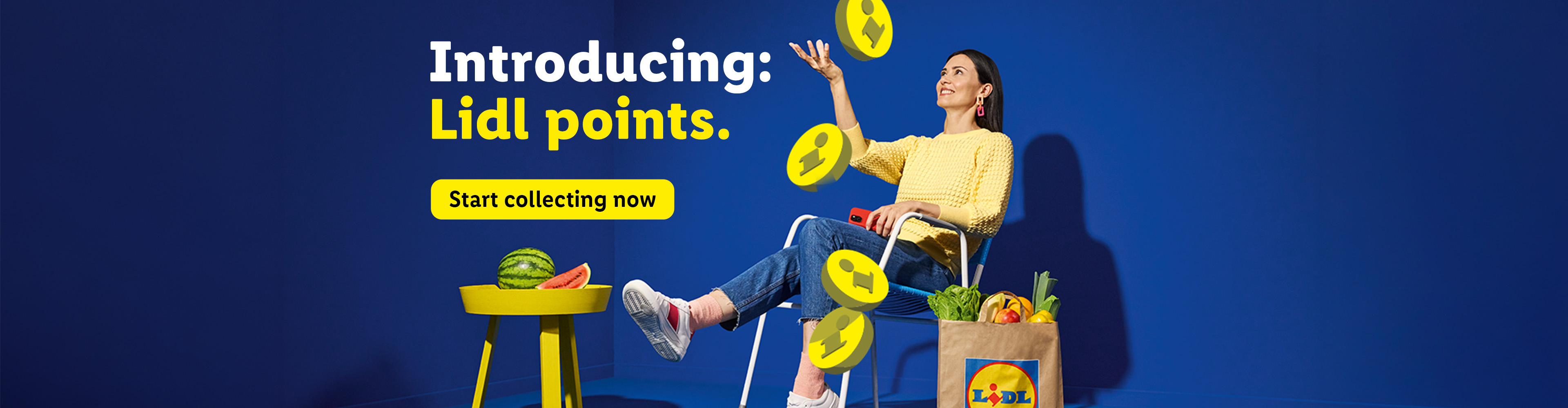 Woman collecting points, with groceries and watermelon, against a blue background. Text: Introducing: Lidl points. Start collecting now.
