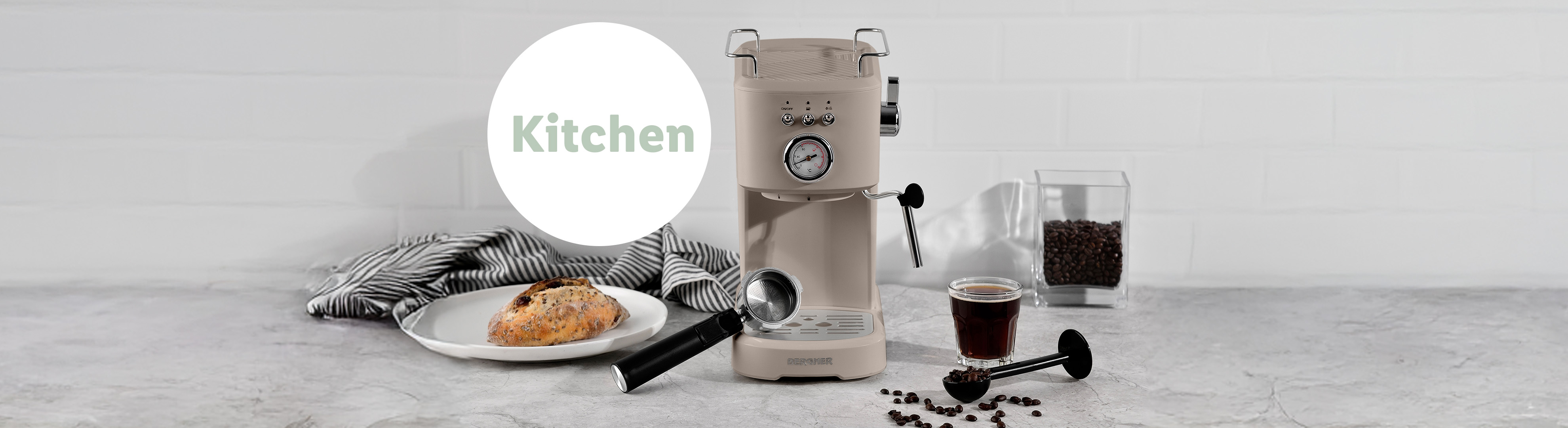 A beige KitchenAid espresso machine sits on a kitchen counter with coffee beans and a cup of espresso.