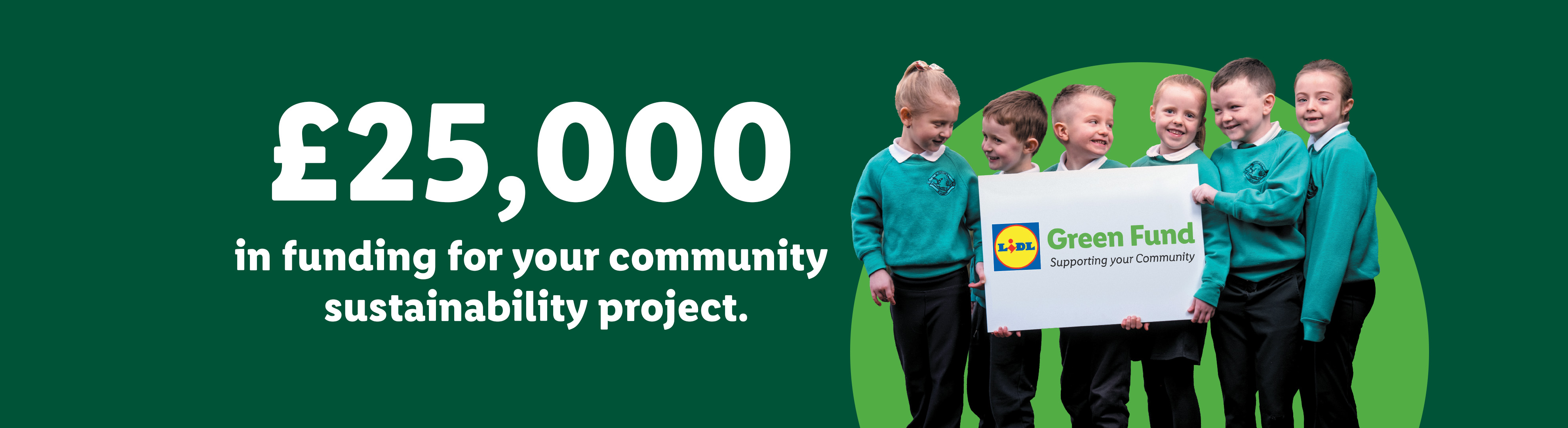 Children holding a sign for a Green Fund, offering £25,000 for community sustainability projects.