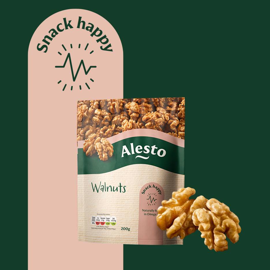 A bag of walnuts with a 'Snack happy' label, next to loose walnuts.