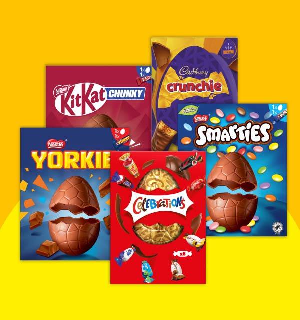 Assortment of chocolate Easter eggs and candy boxes, including Smarties and Kit Kat Chunky.