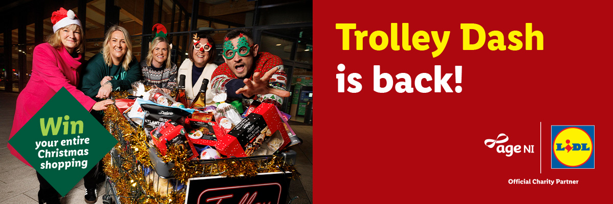 People in festive attire with a shopping trolley full of Christmas groceries, text 'Trolley Dash is back!'