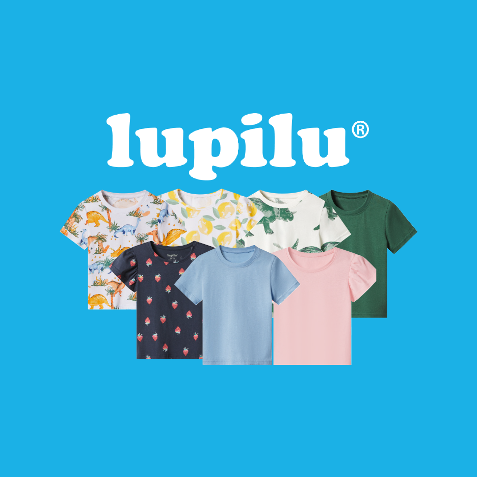 A collection of children's short-sleeved t-shirts in various colors and patterns, including dinosaurs, lemons, and strawberries.