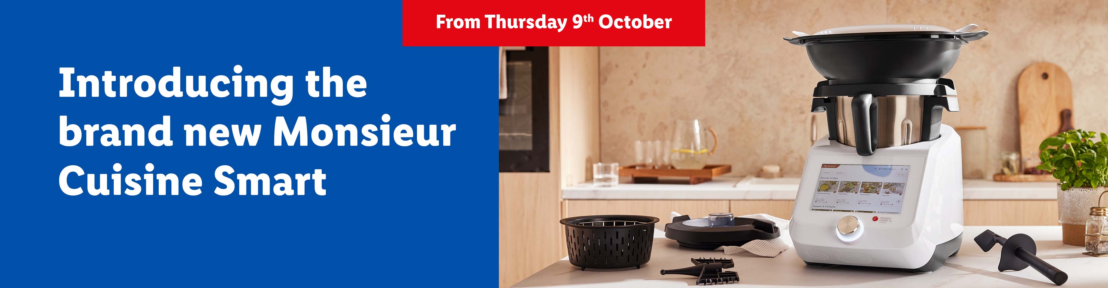 A white Monsieur Cuisine Smart food processor on a kitchen counter with text announcing its launch.